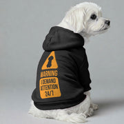 Maltese dog wearing an 'I Demand Attention 24/7' hoodie
