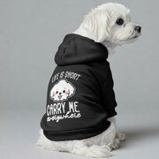 Maltese dog wearing a 'Life Is Short, Carry Me Everywhere' hoodie