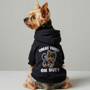 Yorkie wearing a 'Treat Thief on Duty' hoodie