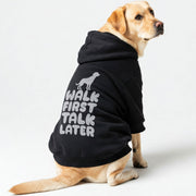 Labrador wearing a 'Walk First, Talk Later' hoodie