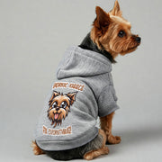 Yorkie wearing a 'Yorkie Kisses Fix Everything' hoodie