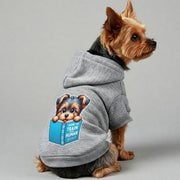 Yorkie wearing a 'How to Train Your Human' hoodie